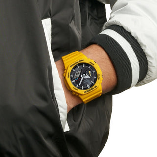 Angle shot of Casio G-Shock GA-B2100C-9AER Black Dial Yellow Resin Mens Watch on white background