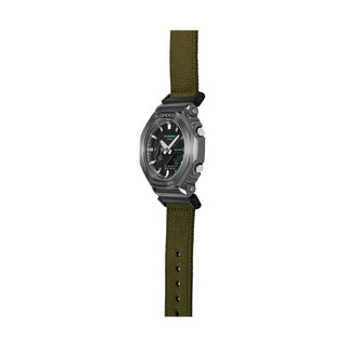 Angle shot of Casio G-Shock GM-2100CB-3AER Black Dial Green Fabric Mens Watch on white background