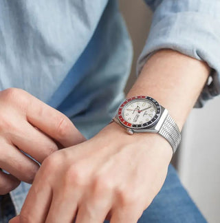 Angle shot of Timex Q Reissue TW2U61200 White Dial Grey Stainless Steel Mens Watch on white background