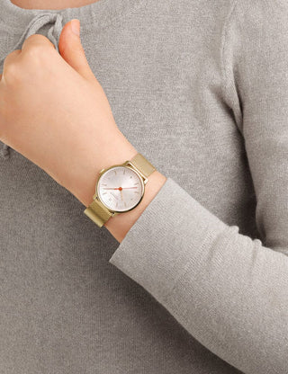 Angle shot of Mondaine MLE.33111.SM White Dial Gold Stainless Steel Womens Watch on white background